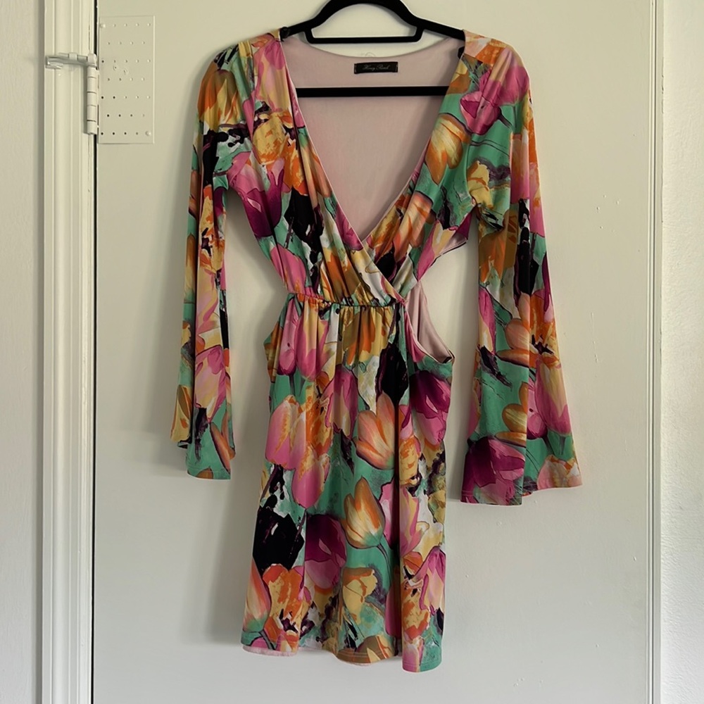 Pink, orange and teal long sleeve dress with cutout design on sides